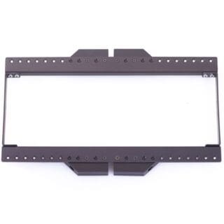 Rectangular black metal bracket or frame with multiple holes along its edges, often used in audio or video setups, viewed from above on a white background.