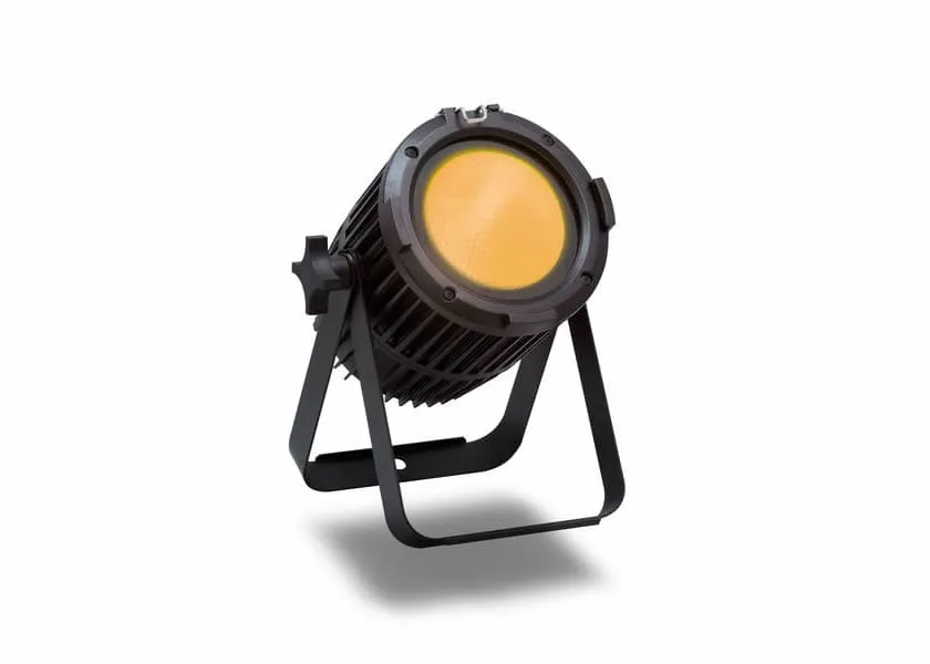 A black LED stage spotlight with a yellow lens is mounted on a support bracket, angled slightly upward, ideal for professional lighting in video or audio productions, set against a plain white background.
