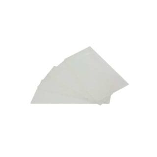 Four transparent plastic sheets are stacked slightly askew on a plain white background, with the lighting highlighting their clean edges and sleek surface.